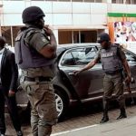 File photo of police orderlies tending to a VIP