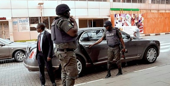 File photo of police orderlies tending to a VIP