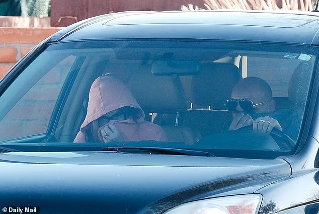 Annie Guthrie and her husband, Tommaso Cioni, leaving their home on February 3 (Photo: Daily Mail)