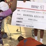 Samuel Adeniyi's mother, Bayuztv presenter and Samuel lying on the floor after hearing about the gifts he had gotten so far. (Photo credit: BAYUZTV)