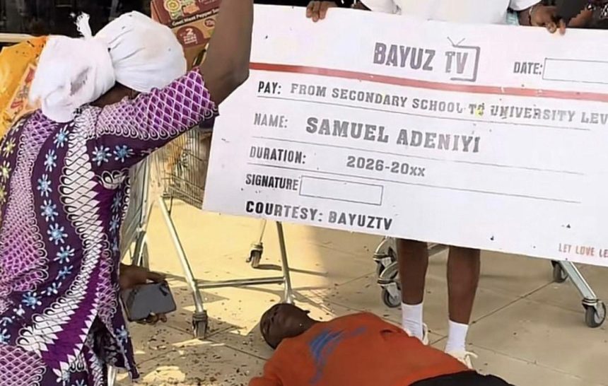 Samuel Adeniyi's mother, Bayuztv presenter and Samuel lying on the floor after hearing about the gifts he had gotten so far. (Photo credit: BAYUZTV)