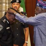 President Bola Tinubu decorating Ag. IGP Tunji Disu