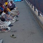 File photo of illegal settlers on a pedestrian bridge in Lagos