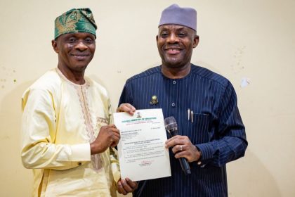 Minister of Education, Tunji Alausa (Right), presenting the certificate of appointment to Prof. Onibon (Left) as the Pioneer Rector of Bola Ahmed Tinubu Federal Polytechnic, Abuja