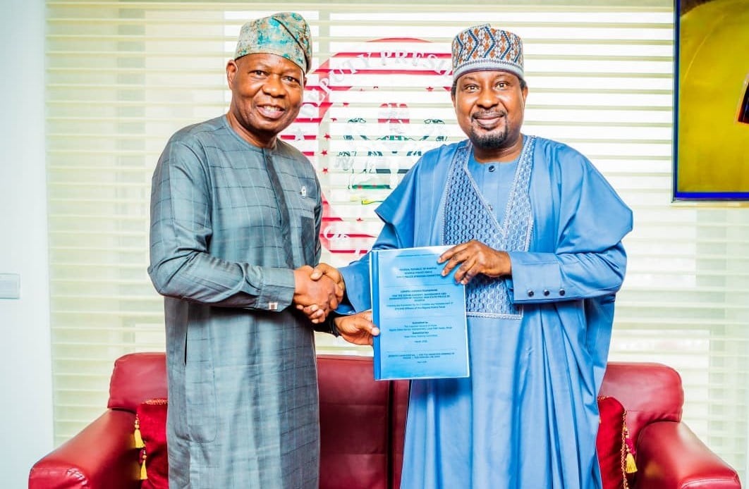 L–R: Olu Ogunsakin, representing the IGP Tunji Disu, presenting a framework for state police creation to Deputy Senate President Barau Jibrin at the national assembly complex, Abuja, on Thursday