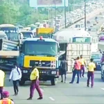 Commuters Stranded as Truck Overturns Near Kara Bridge