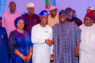 Lagos State Governor, Babajide Sanwo-Olu congratulates Deputy Governor and APC governorship candidate, Obafemi Hamzat, after winning the primary election