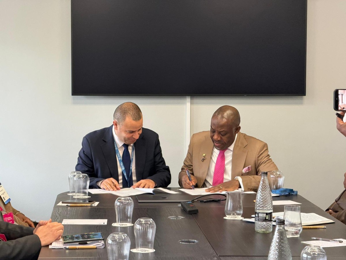 Minister of Education, Tunji Alausa, signing the Digital Training Academy (DTA) agreement with Coursera in London