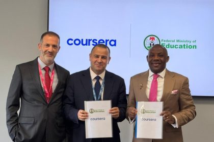 Minister of Education, Tunji Alausa, and Coursera executives with the Digital Training Academy (DTA) agreement in London