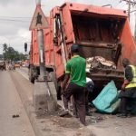 LAWMA intervention team members clearing up heaps of dumped waste from the median of the Egbeda–Idimu Road and Lawanson, Surulere corridor on Tuesday, June 16, 2026