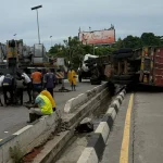 Two Motorists Escape Death as Container Truck Falls on Lagos Airport Road