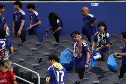 Japan fans tidy Dallas stadium after their 2-2 draw with Netherlands on Sunday