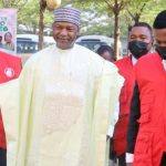 Former Attorney-General of the Federation (AGF), Abubakar Malami (middle), flanked by EFCC officers, arriving at the Federal High Court in Abuja following his arraignment over allegations bordering on money laundering