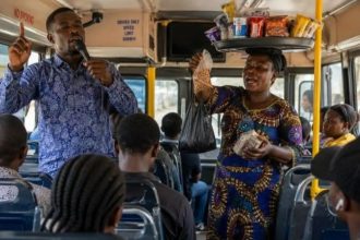 File photo of a preacher and a trader in a commercial vehicle