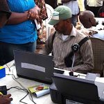 File photo of INEC officials registering prospective voters to vote