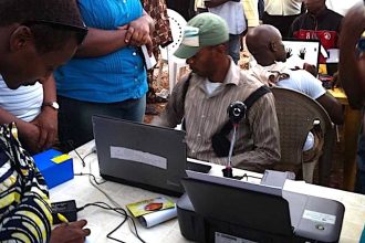 File photo of INEC officials registering prospective voters to vote
