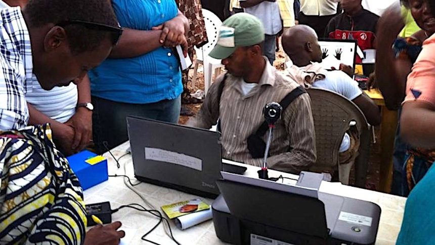 File photo of INEC officials registering prospective voters to vote