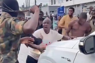 Screenshot from a video showing some young men widely described as agberos blocking a guest at Peller's wedding from passing until they give them money