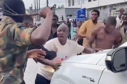 Screenshot from a video showing some young men widely described as agberos blocking a guest at Peller's wedding from passing until they give them money